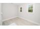 Bedroom with two windows that offers natural light and neutral walls at 407 Carolina Ave, Raleigh, NC 27606