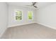 Bedroom with carpet flooring, and two windows that bring in lots of natural light at 407 Carolina Ave, Raleigh, NC 27606