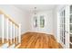 Bright foyer with hardwood floors, white trim, and French doors at 407 Carolina Ave, Raleigh, NC 27606