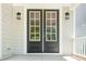 Close up of the front door with glass panels and a sidelight at 407 Carolina Ave, Raleigh, NC 27606