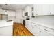 Bright kitchen with white cabinets, stainless steel appliances, and a center island at 407 Carolina Ave, Raleigh, NC 27606