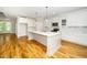 Open kitchen features modern cabinetry, stainless steel appliances, and a large island at 407 Carolina Ave, Raleigh, NC 27606