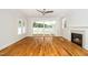 Spacious living room with hardwood floors, a fireplace, and sliding glass doors at 407 Carolina Ave, Raleigh, NC 27606