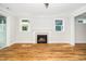 Living room featuring a fireplace with tiled hearth and white mantel at 407 Carolina Ave, Raleigh, NC 27606