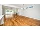 Bright living room with hardwood floors, a fireplace, and sliding glass doors to the backyard at 407 Carolina Ave, Raleigh, NC 27606