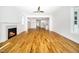 Open-concept floor plan from living room to kitchen with hardwood flooring throughout at 407 Carolina Ave, Raleigh, NC 27606