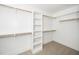 Walk-in closet with carpet, shelves and hanging rods at 407 Carolina Ave, Raleigh, NC 27606