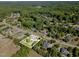 Expansive aerial view of a home nestled among mature trees in a lovely residential neighborhood at 4117 Stansted Dr, Fuquay Varina, NC 27526