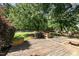 Spacious wooden deck area with built-in benches and planters overlooking the backyard at 4117 Stansted Dr, Fuquay Varina, NC 27526