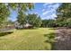 Open backyard featuring a trampoline and wooden deck area, great for outdoor activities at 4117 Stansted Dr, Fuquay Varina, NC 27526