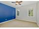 Bright bedroom with natural light, complemented by a bold accent wall at 4117 Stansted Dr, Fuquay Varina, NC 27526