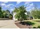 Two-story home with attached garage, basketball hoop, and a well-manicured lawn and landscaping at 4117 Stansted Dr, Fuquay Varina, NC 27526