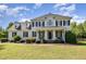 Charming two-story home with well-maintained lawn and traditional architectural details at 4117 Stansted Dr, Fuquay Varina, NC 27526