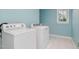 Well-lit laundry room equipped with a washer and dryer set at 4117 Stansted Dr, Fuquay Varina, NC 27526