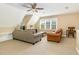 Comfortable living room with a ceiling fan, window, and cozy seating, perfect for relaxation at 4117 Stansted Dr, Fuquay Varina, NC 27526