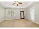 Spacious main bedroom featuring a ceiling fan and a large window providing natural light at 4117 Stansted Dr, Fuquay Varina, NC 27526