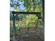 Wooden swing set with a beautiful view of the lake and nearby house at 4117 Stansted Dr, Fuquay Varina, NC 27526