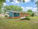 View of a large backyard with mature trees and lush greenery at 413 Winterlochen Rd, Raleigh, NC 27603