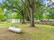 Large backyard with a storage shed and a propane tank for the home at 413 Winterlochen Rd, Raleigh, NC 27603