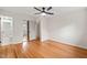 Light-filled bedroom with hardwood floors and an en-suite bathroom, ideal for relaxation at 413 Winterlochen Rd, Raleigh, NC 27603