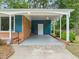 Attached carport with brick and siding accents, offering covered parking at 413 Winterlochen Rd, Raleigh, NC 27603