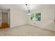 Dining room with an elegant chandelier and bright natural light at 413 Winterlochen Rd, Raleigh, NC 27603