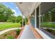 Charming covered front porch with lovely landscaping at 413 Winterlochen Rd, Raleigh, NC 27603