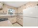 Functional kitchen with granite counters, white cabinetry, and modern appliances, creating a welcoming atmosphere at 413 Winterlochen Rd, Raleigh, NC 27603