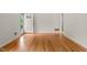 This living room includes gleaming hardwood floors and natural lighting at 413 Winterlochen Rd, Raleigh, NC 27603
