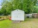 Exterior shot of a storage shed in the backyard with a double door entrance at 413 Winterlochen Rd, Raleigh, NC 27603
