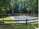 Greenbrier Park tennis courts, playground and pavilion in natural setting at 413 Winterlochen Rd, Raleigh, NC 27603