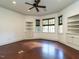 This bonus room features hardwood floors, recessed lighting, built in shelves and cabinets, and windows at 4143 Gardenlake Dr, Raleigh, NC 27612