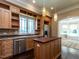 Gourmet kitchen featuring an island, stainless appliances, granite countertops, and ample storage at 4143 Gardenlake Dr, Raleigh, NC 27612