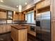 Stylish kitchen with stainless steel appliances, custom cabinetry, and a functional island at 4143 Gardenlake Dr, Raleigh, NC 27612