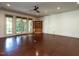 This living room features hardwood floors, recessed lighting, and doors to the backyard at 4143 Gardenlake Dr, Raleigh, NC 27612