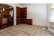 Cozy living room featuring custom built-in shelves and an open layout leading to the kitchen at 4143 Gardenlake Dr, Raleigh, NC 27612