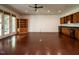 This living room features hardwood floors, recessed lighting, built in cabinets, and a wet bar at 4143 Gardenlake Dr, Raleigh, NC 27612