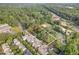 Aerial view of property and neighborhood with mature trees near a baseball field at 418 Madison Ave, Cary, NC 27513