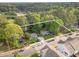 Aerial view of homes with mature trees and landscaping, showing property lines at 418 Madison Ave, Cary, NC 27513