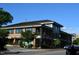 Exterior view of a modern office building with brick and metal accents, showcasing its architectural design at 418 Madison Ave, Cary, NC 27513
