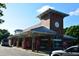 Exterior shot of Cary Train Station on a clear day showcasing its brick facade and clock tower at 418 Madison Ave, Cary, NC 27513
