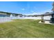 Large backyard with a white fence and plenty of green grass at 43 Jonalker Ct, Clayton, NC 27520