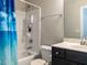 Full bathroom featuring shower-tub combo and dark-stained vanity at 43 Jonalker Ct, Clayton, NC 27520