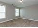 Bedroom with neutral carpet and two windows allowing for plenty of light at 43 Jonalker Ct, Clayton, NC 27520