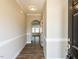 Inviting hallway with wood floors and decorative moldings, leading to various rooms in the home at 43 Jonalker Ct, Clayton, NC 27520