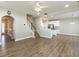 Open-concept living space with a staircase, modern flooring, and seamless flow to the kitchen at 43 Jonalker Ct, Clayton, NC 27520