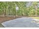 Private basketball court surrounded by mature trees at 4420 Dula St, Durham, NC 27705