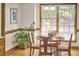 Well-lit dining room features a round table, natural light, and ample seating at 4420 Dula St, Durham, NC 27705