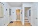 The home's entryway leads to a laundry room and stairs to the second floor at 4420 Dula St, Durham, NC 27705