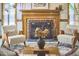 Detailed view of a living room fireplace with seating and decor at 4420 Dula St, Durham, NC 27705